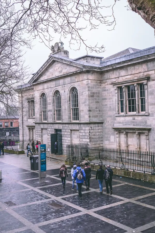 Adult visitors exploring historical prison exhibitions and Irish independence displays