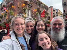 Families with teenagers discovering Irish independence history together through prison tours