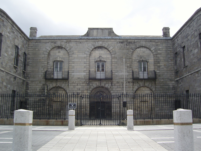 Historic facade of Kilmainham Gaol Museum showcasing Victorian prison architecture and stonework